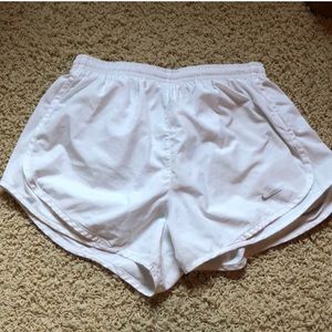 White Nike running shorts